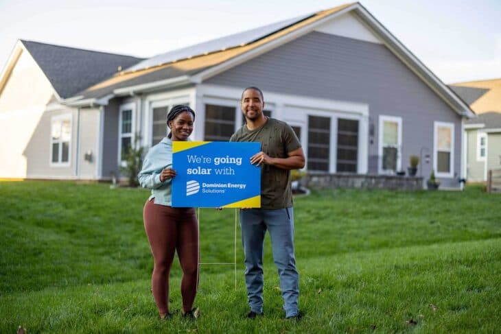 Homeowners with solar panels on their roof