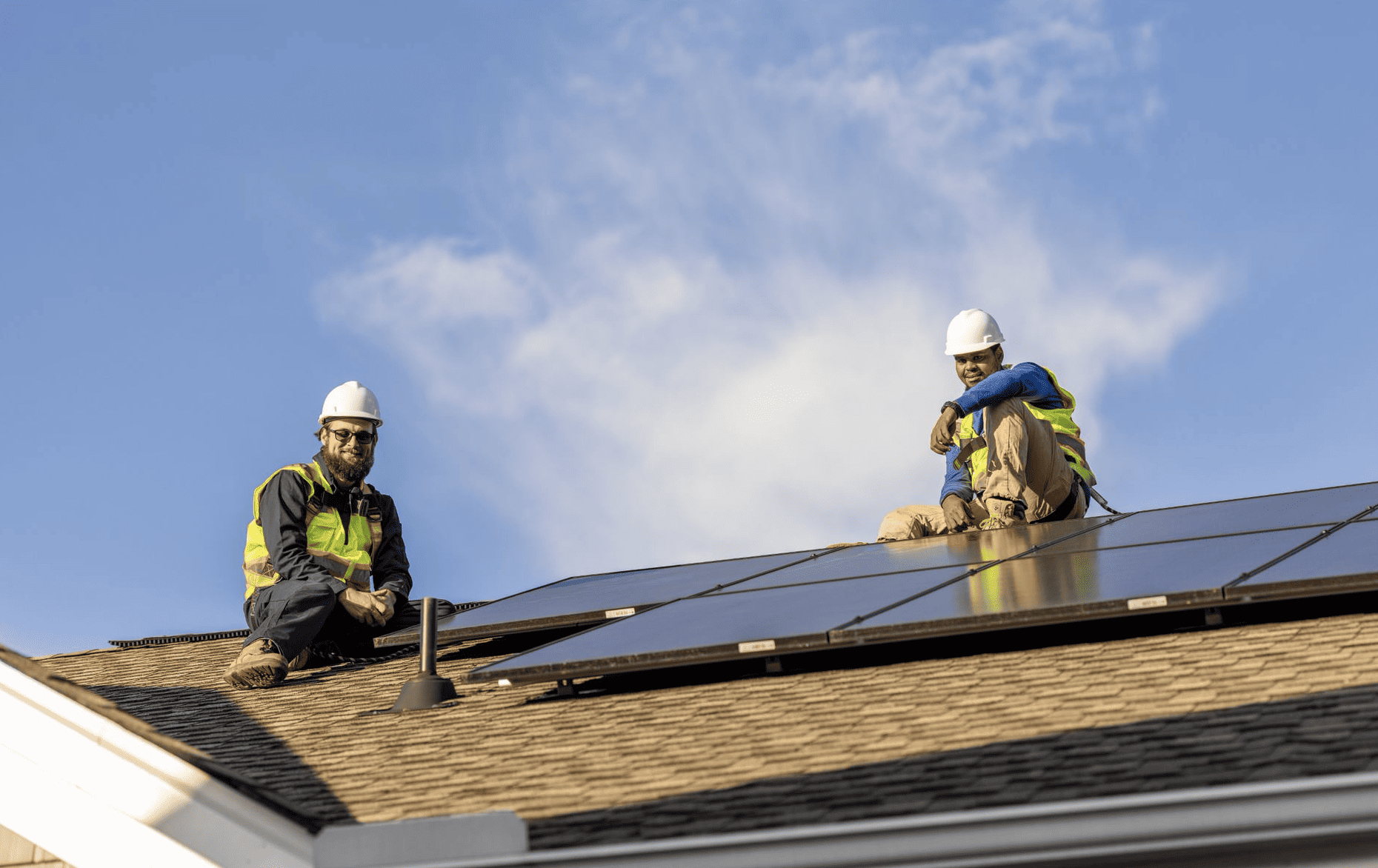 Solar installers on residential roof