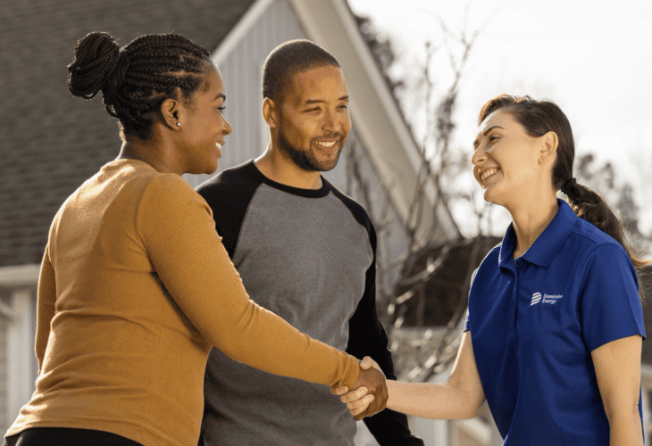 Dominion Energy Solutions Rep shaking hands with homeowners